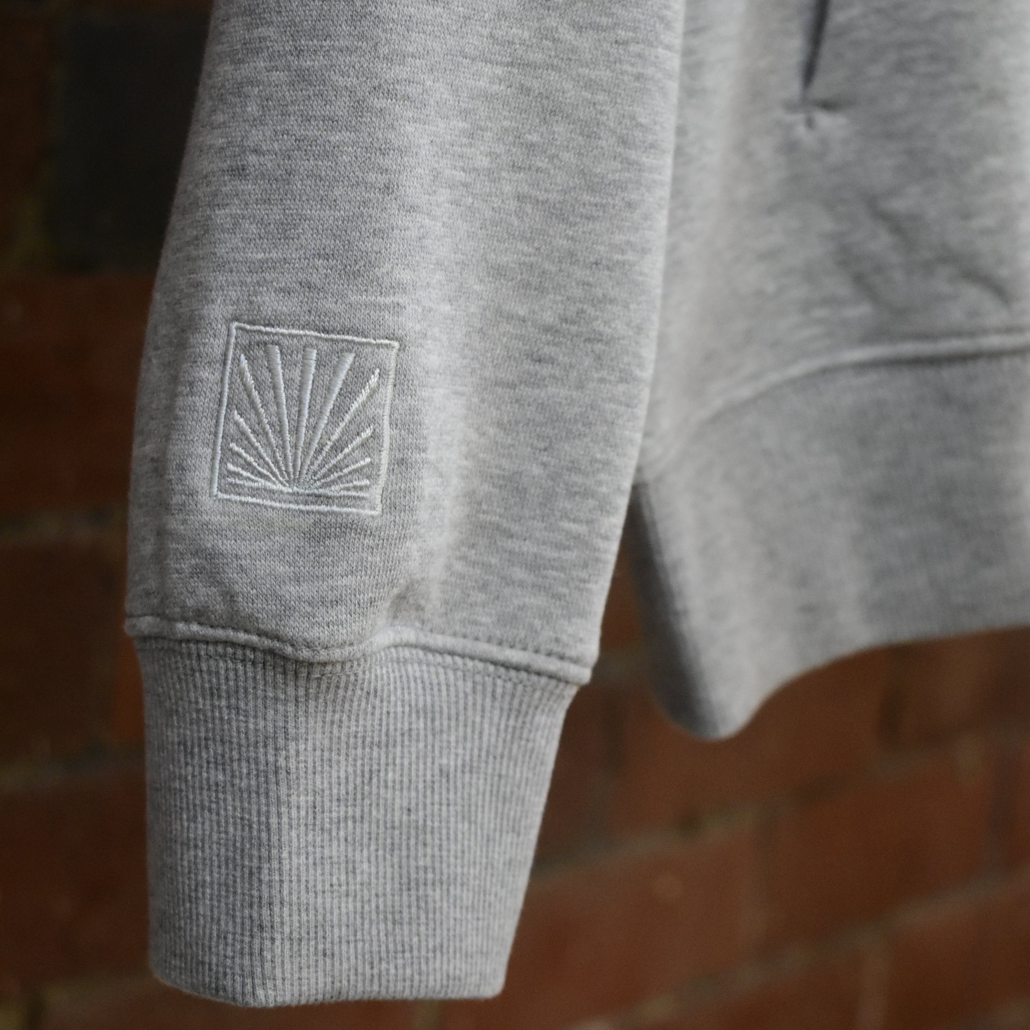 Sunbae logo on hoodie sleeve