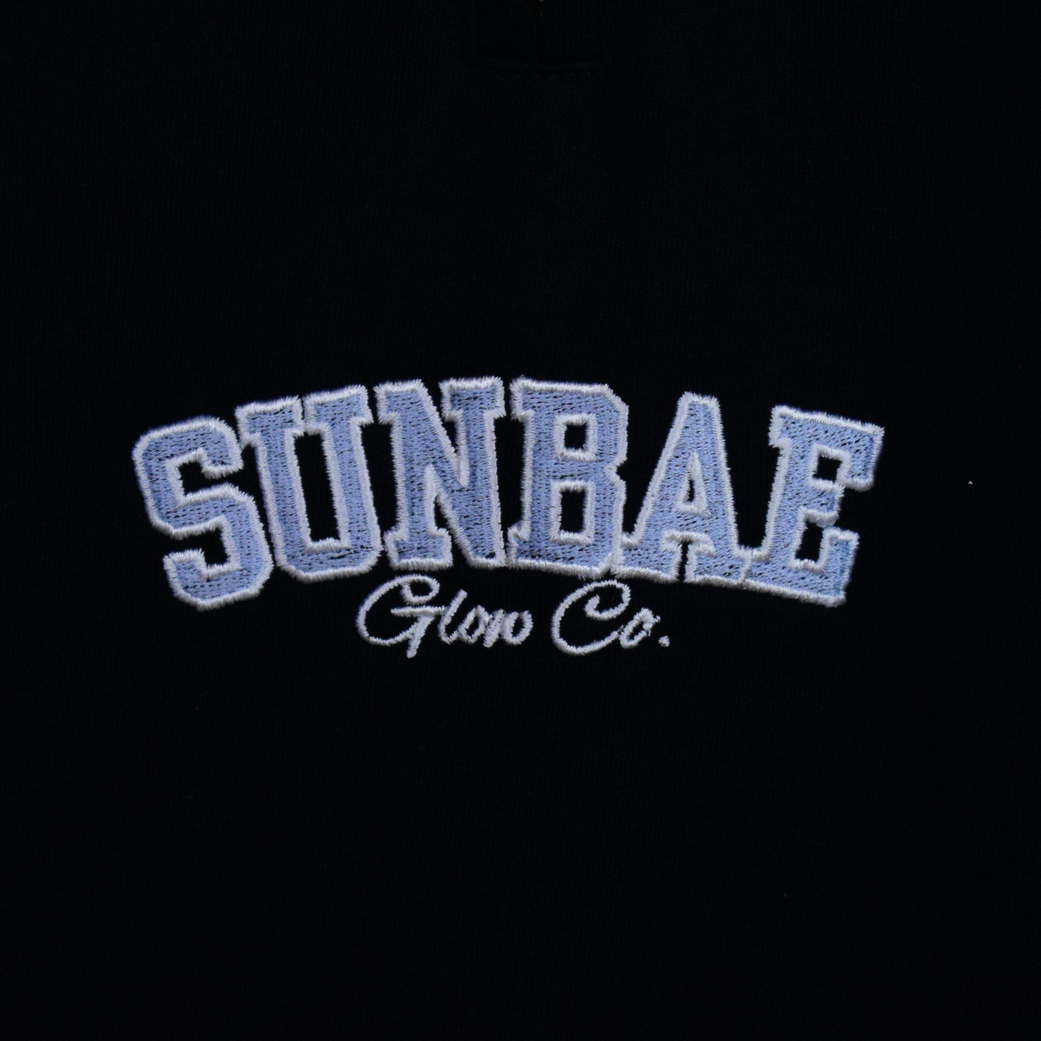Embroidered logo with 'SUNBAE Glow Co.' on a Navy background