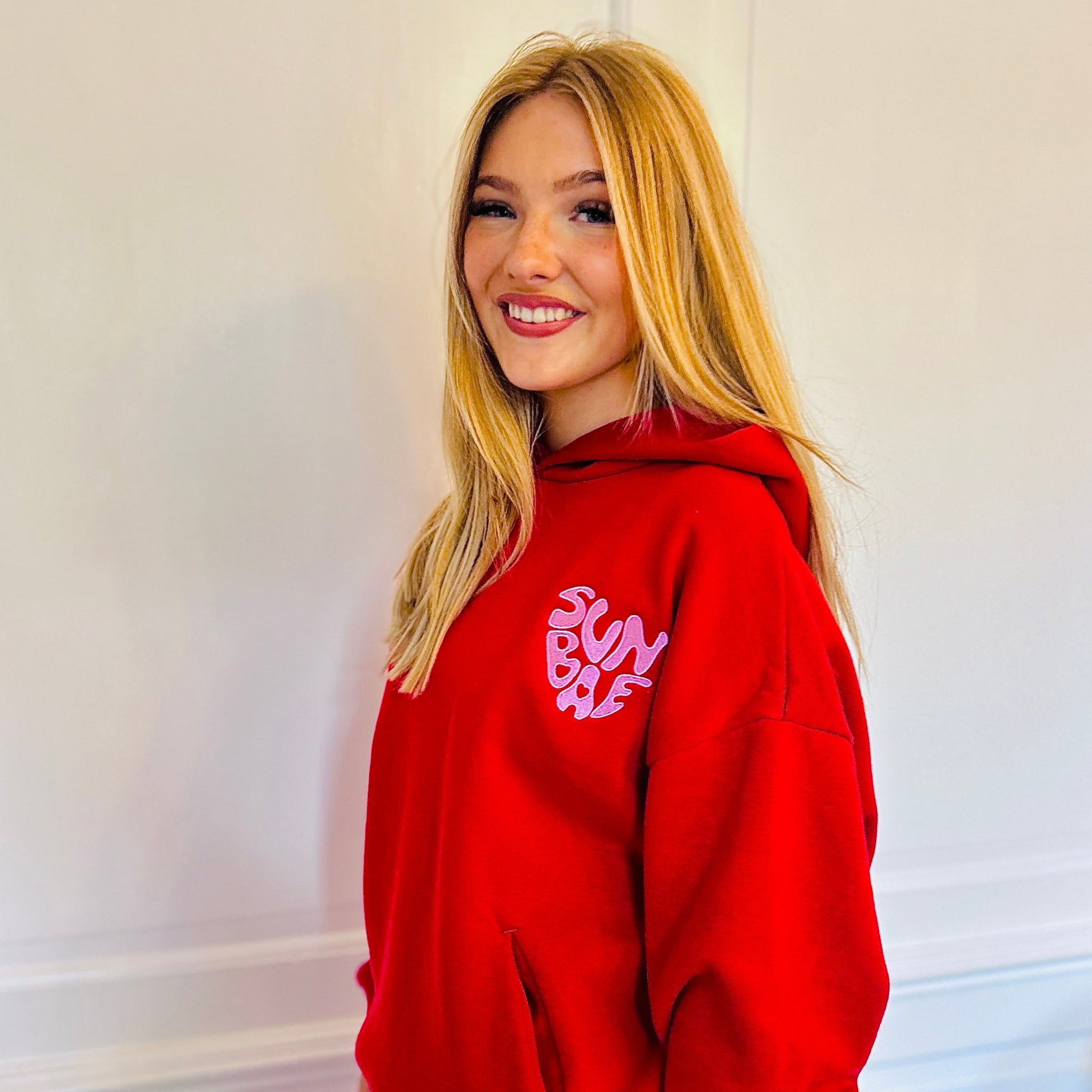 Sunbae Glower wearing the SUNBAE Offline Oversize Hoodie with Glazed Heart Embroidery in Red Glazed Heart in Red