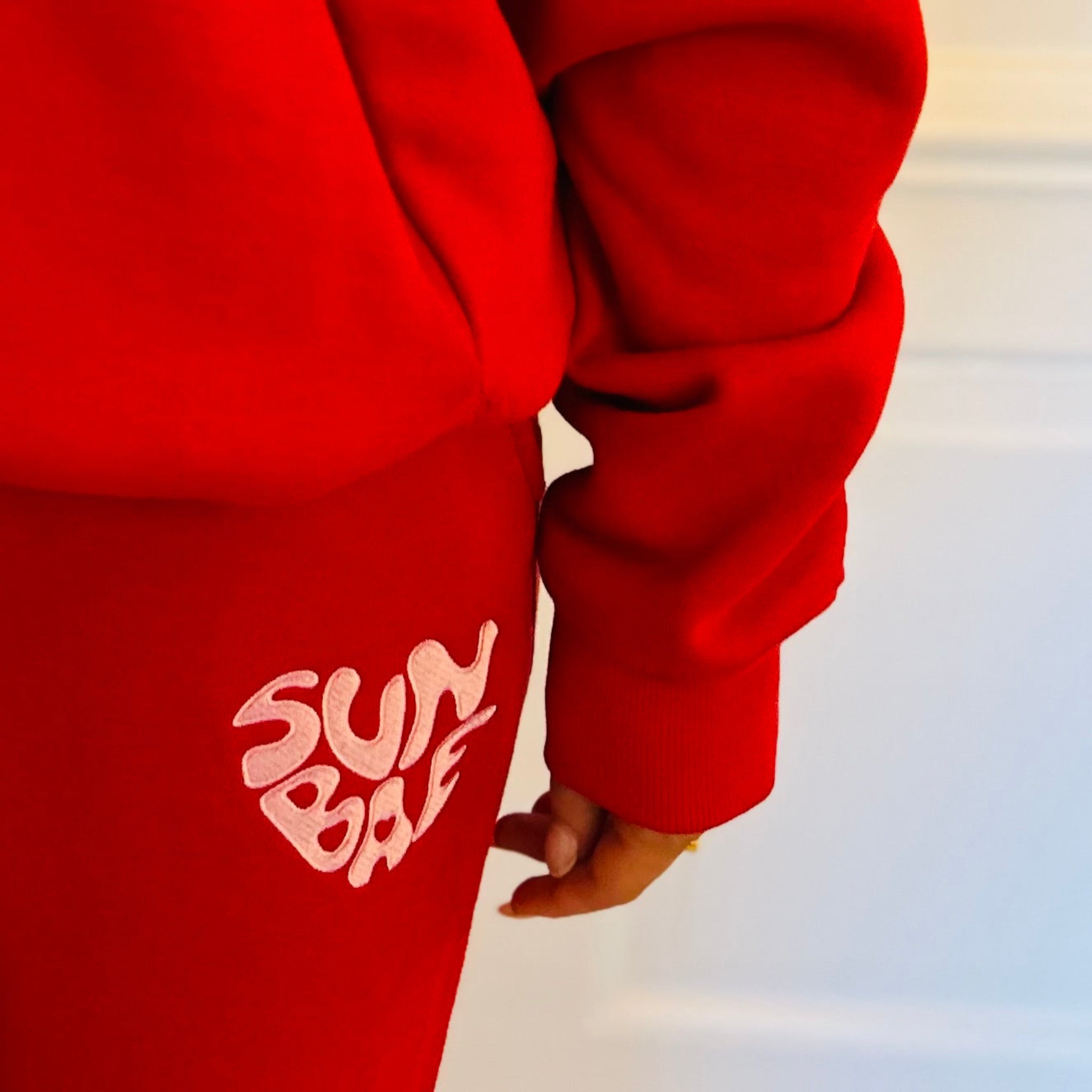 Red hoodie & Sweat Pant with SUNBAE logo on a white background