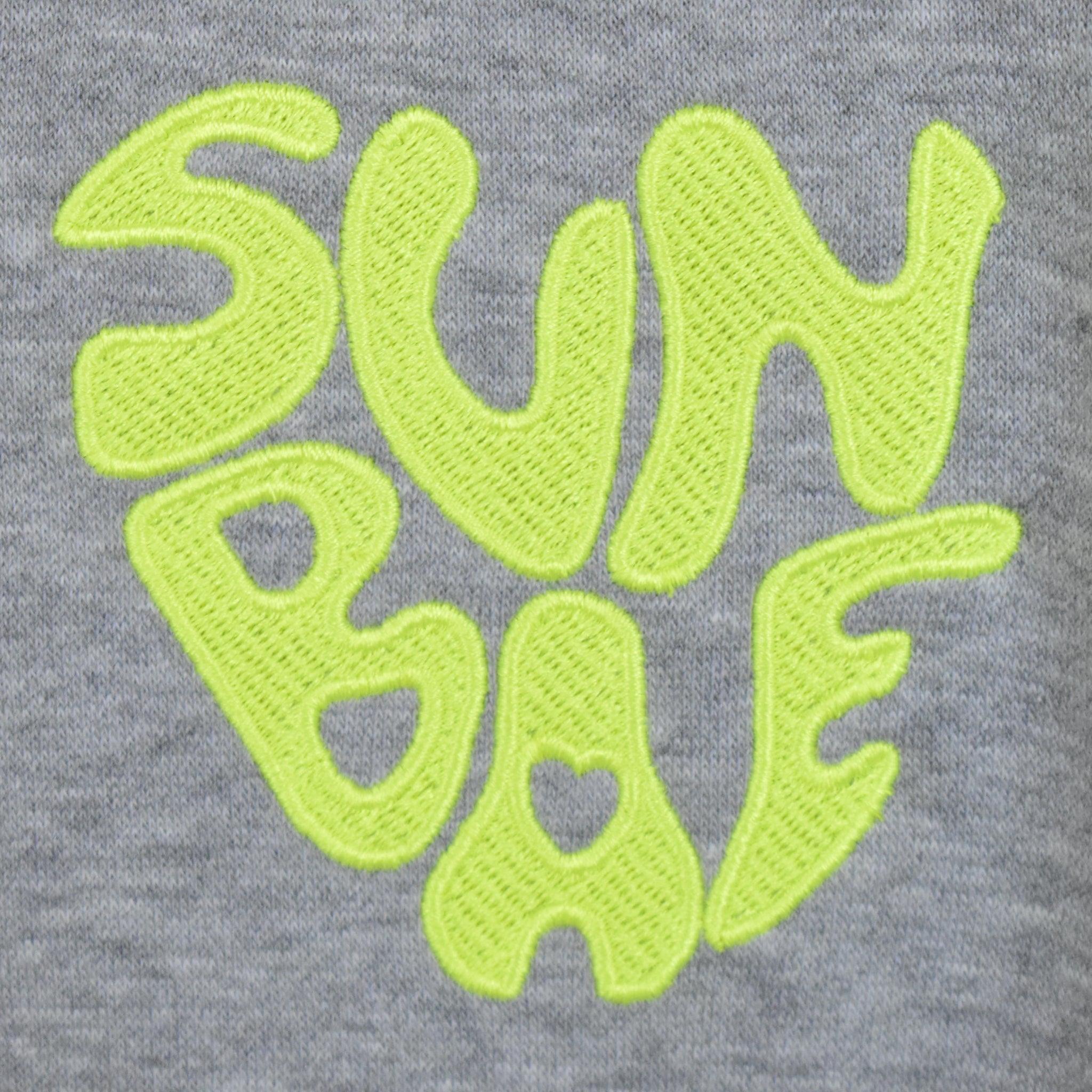 Grey SUNBAE logo embroidered in neon yellow. 