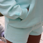 Mint Sunbae hoodie and shorts set with a visible brand logo on the sleeve.