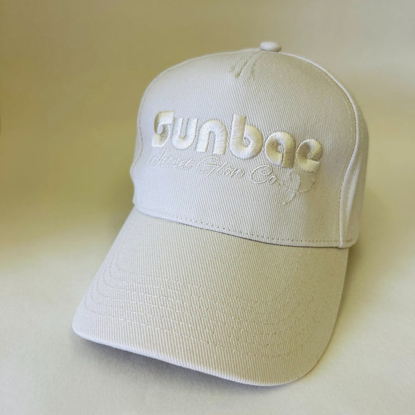 SUNBAE Solar Cap with Embroidered Jetset Logo in Ivory